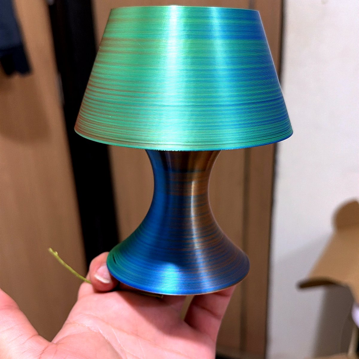 Small 3D printed mushroom-shaped table lamp in teal ombre with a warm glow, compact bedside product photo.